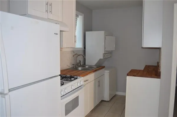 a kitchen with a stove and a refrigerator