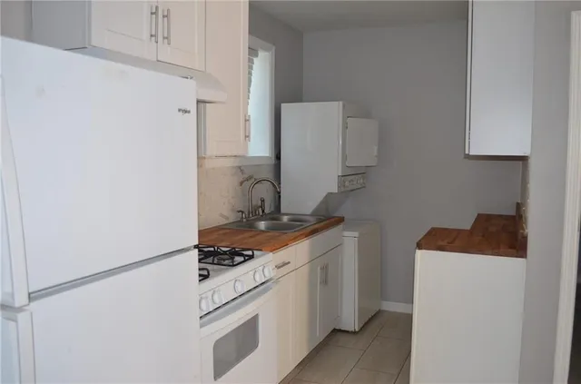 a kitchen with a stove and a refrigerator