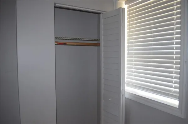 a view of front door with cabinets