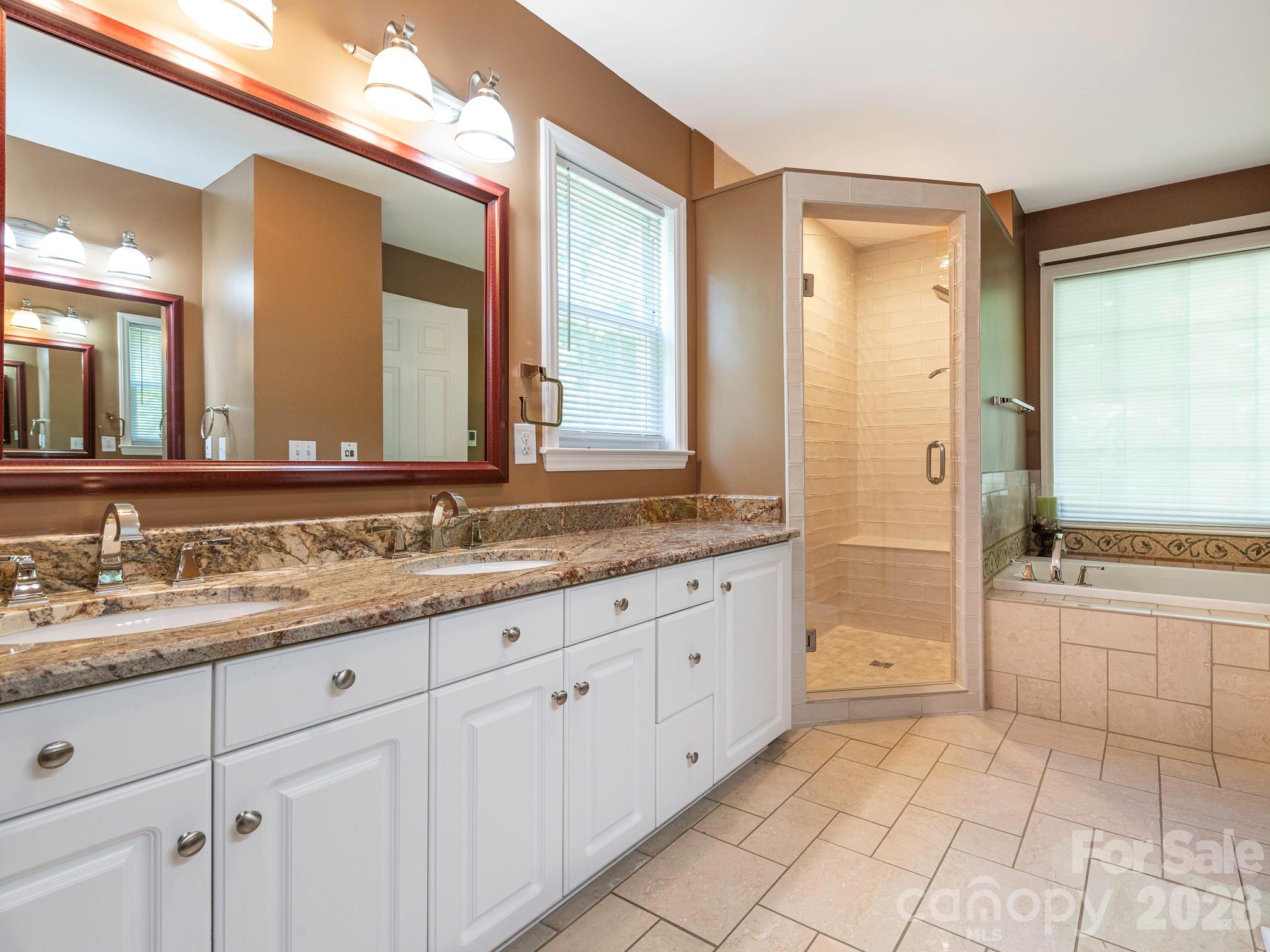 4440 Hucks Road Charlotte, NC 28269 - Photo 22 of 45 a bathroom with a granite countertop sink mirror and a