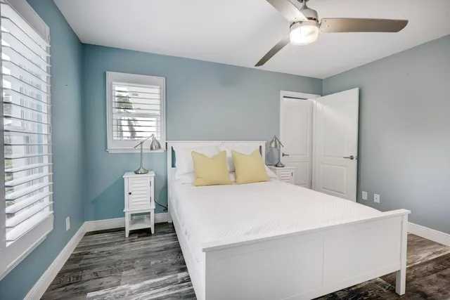 a spacious bathroom with a granite countertop sink mirror and a