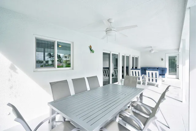 a view of a balcony with two chairs