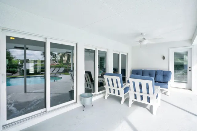 a front view of a house with a yard table and chairs