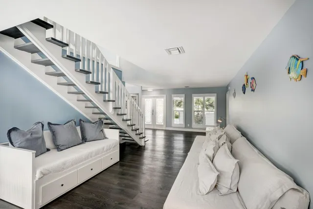 a very nice looking living room with furniture and wooden floor