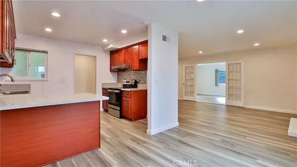 a kitchen with a sink and cabinets