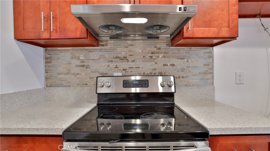 304 Navajo Springs Road Diamond Bar, CA 91765 - Photo 14 of 39 a stove top oven sitting inside of a kitchen