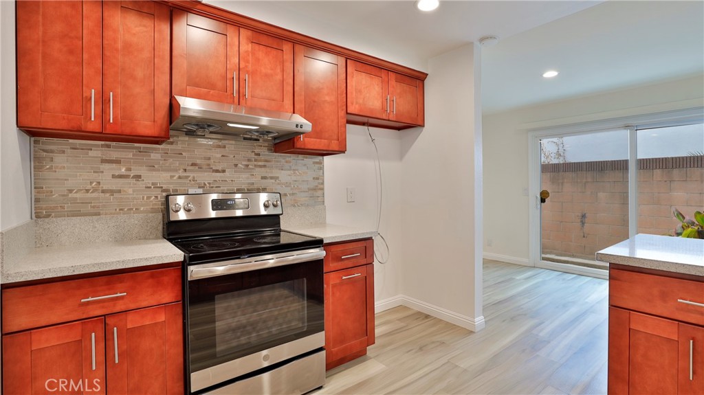 304 Navajo Springs Road Diamond Bar, CA 91765 - Photo 15 of 39 a kitchen with stainless steel appliances granite countertop a stove a sink and a microwave