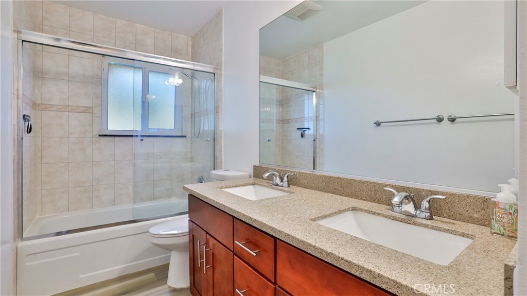 304 Navajo Springs Road Diamond Bar, CA 91765 - Photo 23 of 39 a bathroom with a granite countertop sink mirror and double