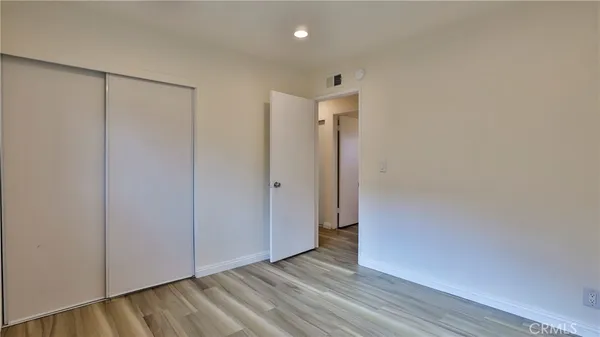 a backyard of a house with plants and trees