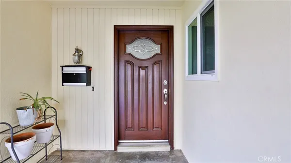 an empty room with wooden floor and fireplace