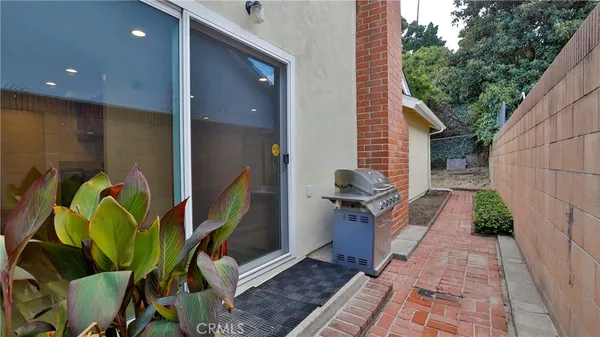 an aerial view of a residential houses with outdoor space