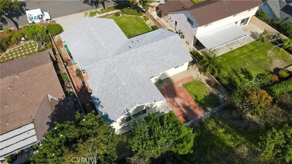 an aerial view of a house with outdoor space