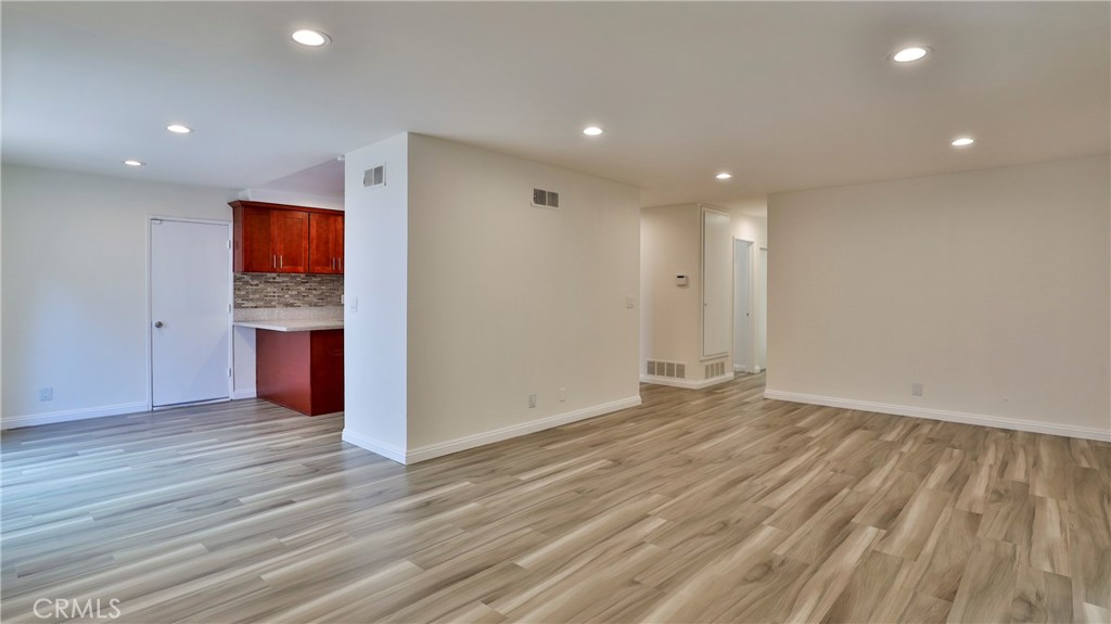 304 Navajo Springs Road Diamond Bar, CA 91765 - Photo 6 of 39 a view of a big room with wooden floor and windows