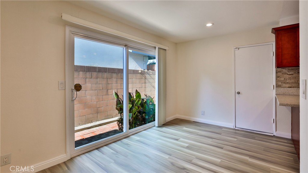 304 Navajo Springs Road Diamond Bar, CA 91765 - Photo 10 of 39 a view of an empty room with wooden floor and a window