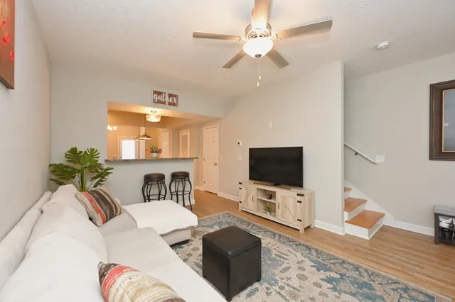 a living room with furniture and a flat screen tv