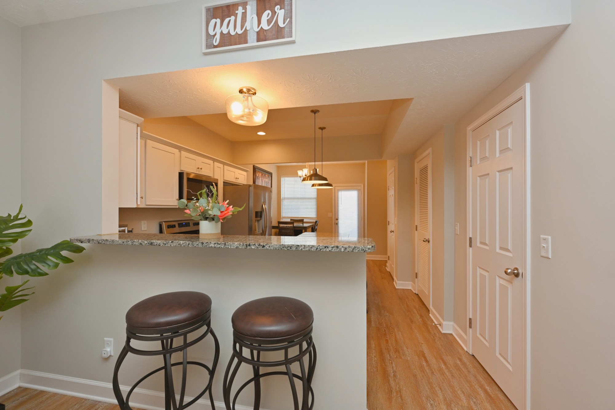 1382 Rural Hill Road, Unit 337 Antioch, TN 37013 - Photo 18 of 45 a kitchen with stainless steel appliances a dining table chairs and a refrigerator