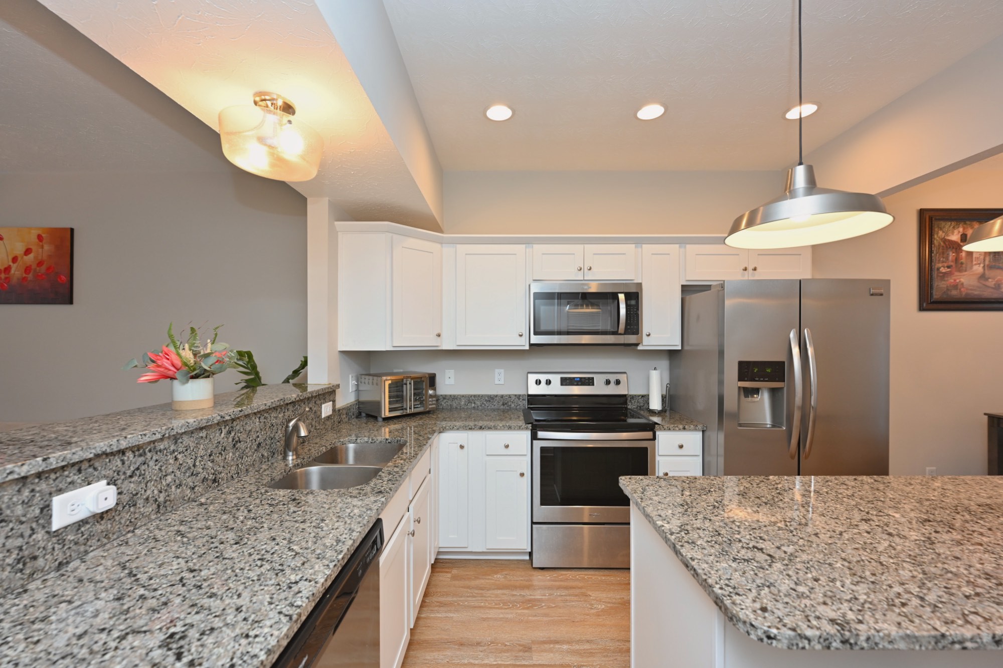 1382 Rural Hill Road, Unit 337 Antioch, TN 37013 - Photo 21 of 45 a kitchen with stainless steel appliances granite countertop a sink refrigerator and microwave