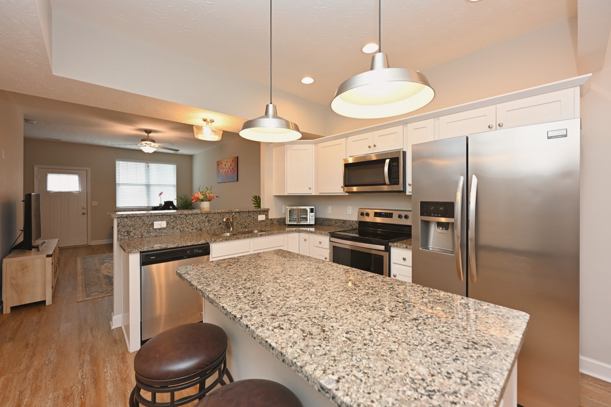 1382 Rural Hill Road, Unit 337 Antioch, TN 37013 - Photo 22 of 45 a kitchen with a refrigerator a stove top oven a sink and dishwasher