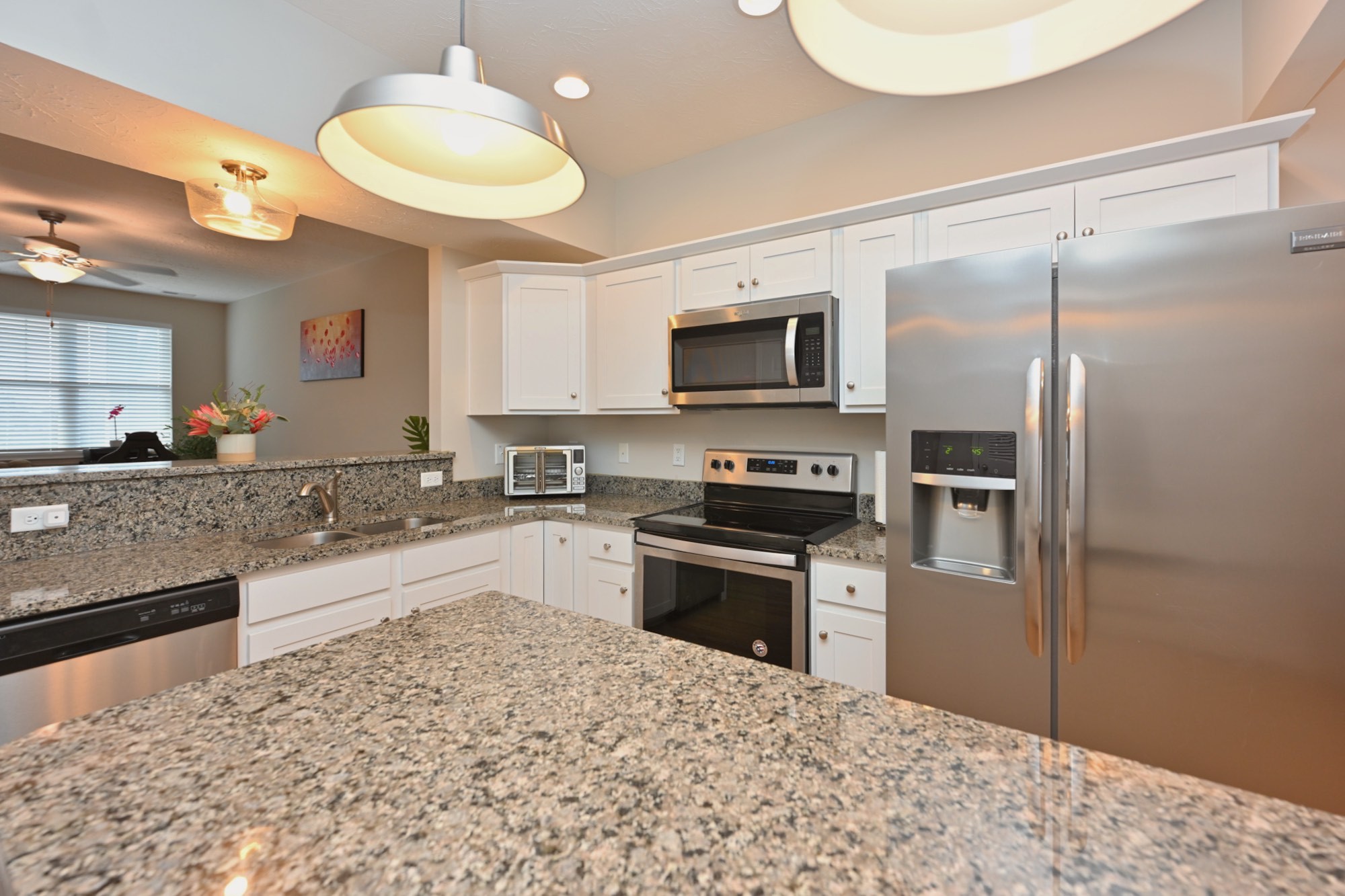 1382 Rural Hill Road, Unit 337 Antioch, TN 37013 - Photo 23 of 45 a kitchen with stainless steel appliances granite countertop a sink refrigerator stove microwave and cabinets