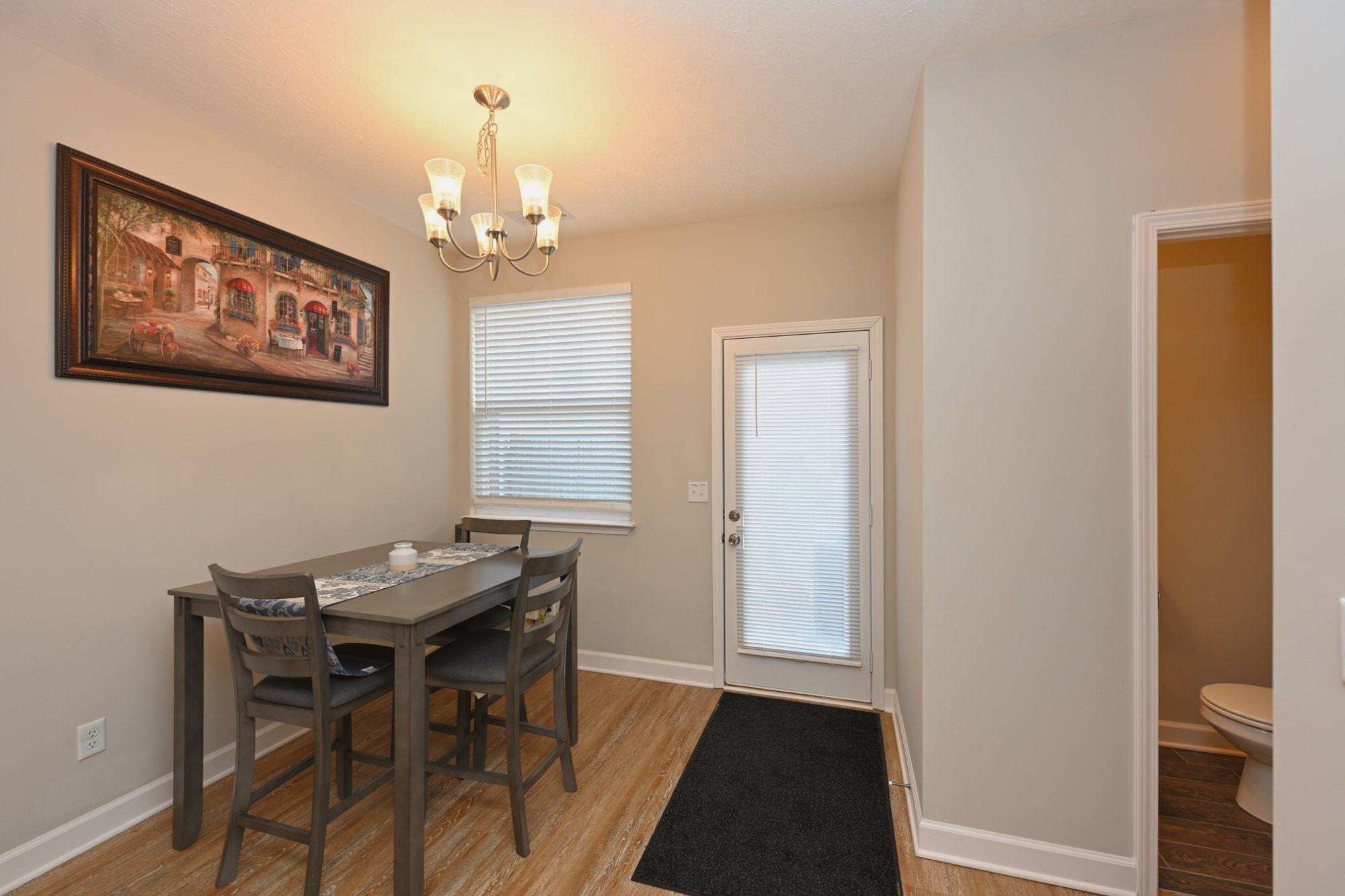 1382 Rural Hill Road, Unit 337 Antioch, TN 37013 - Photo 26 of 45 a view of a dining room with furniture and a chandelier