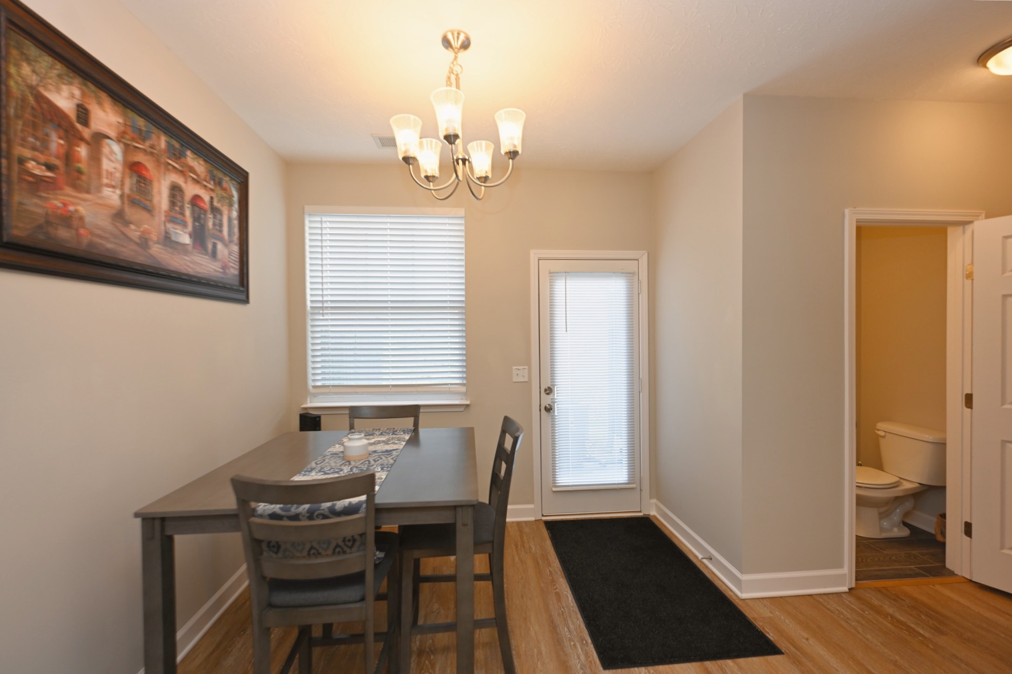 1382 Rural Hill Road, Unit 337 Antioch, TN 37013 - Photo 27 of 45 a view of a dining room with furniture and wooden floor