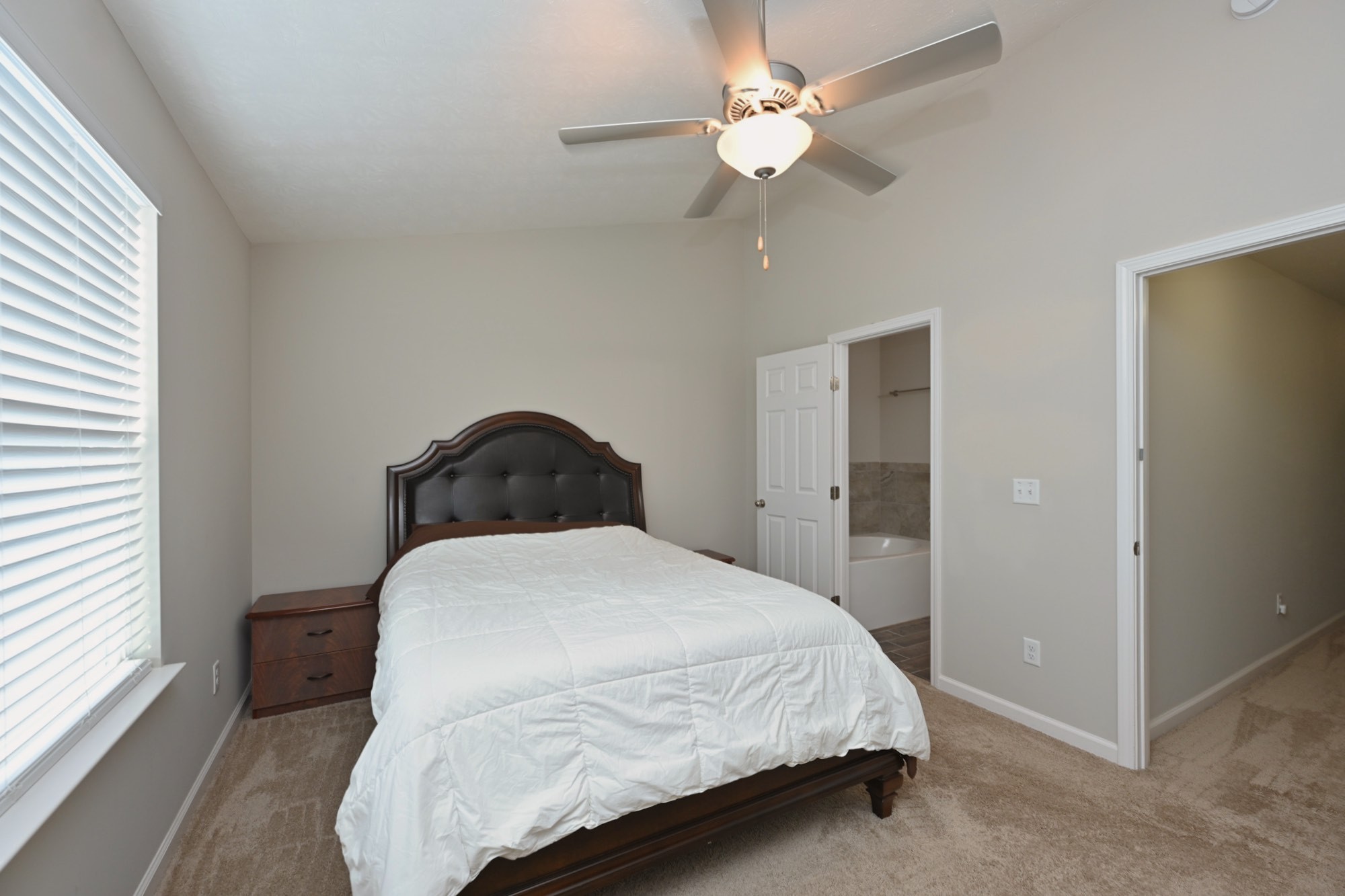 1382 Rural Hill Road, Unit 337 Antioch, TN 37013 - Photo 34 of 45 a bedroom with a bed and a chandelier