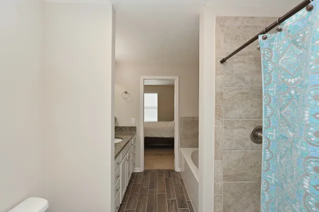 a view of a bathroom from a hallway