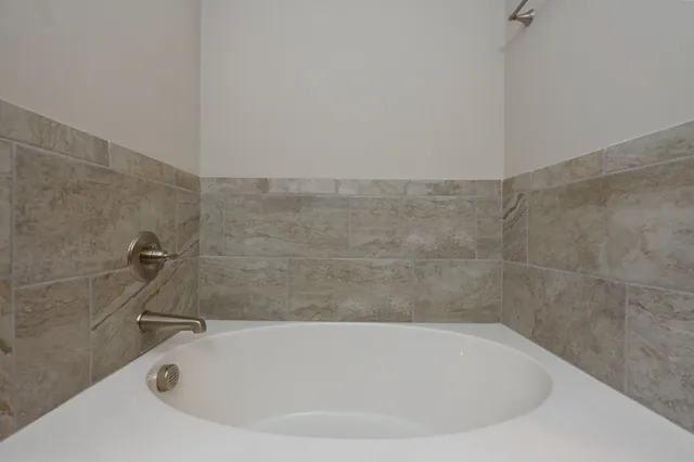 a bath tub sitting in a bathroom