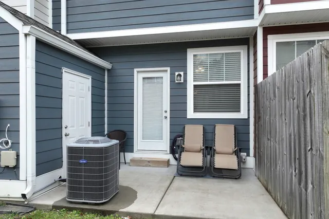 a front view of a house with a bench