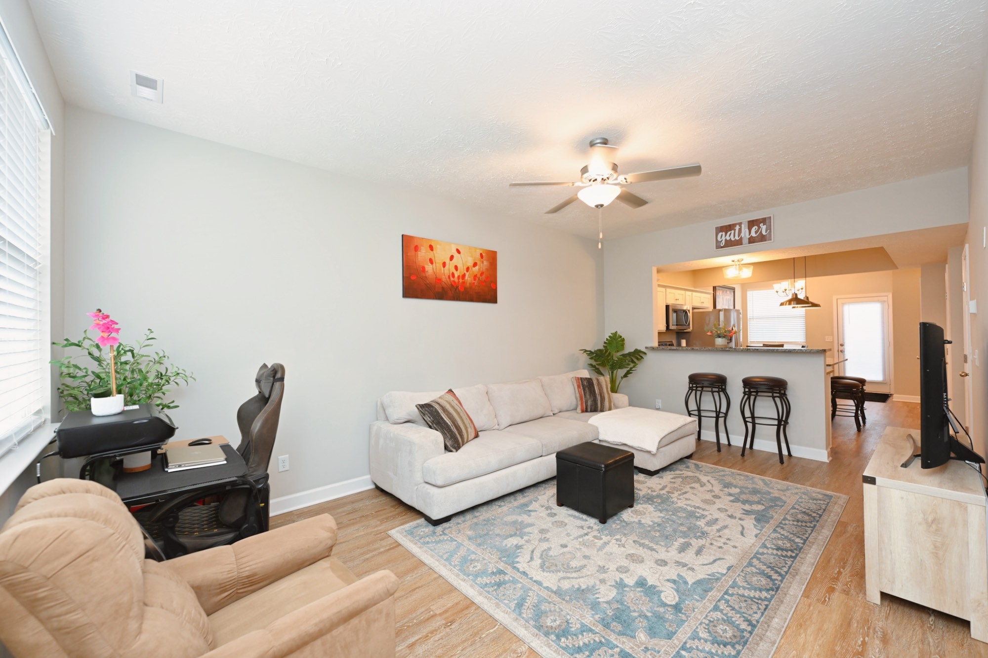 1382 Rural Hill Road, Unit 337 Antioch, TN 37013 - Photo 10 of 45 a living room with furniture flowerpot and a chandelier