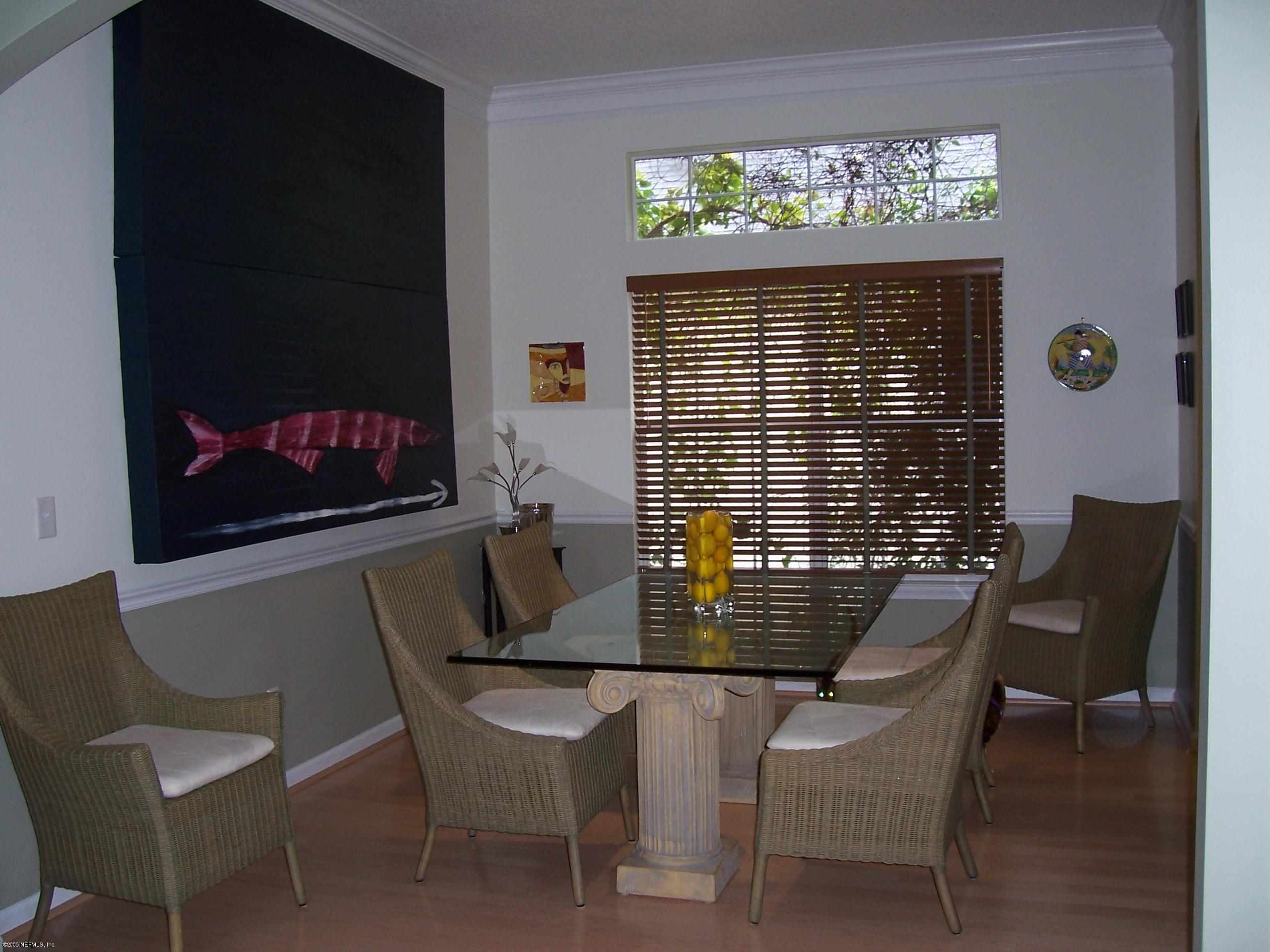 841 Mill Stream Road Ponte Vedra Beach, FL 32082 - Photo 4 of 7 a view of a dining room with furniture and window