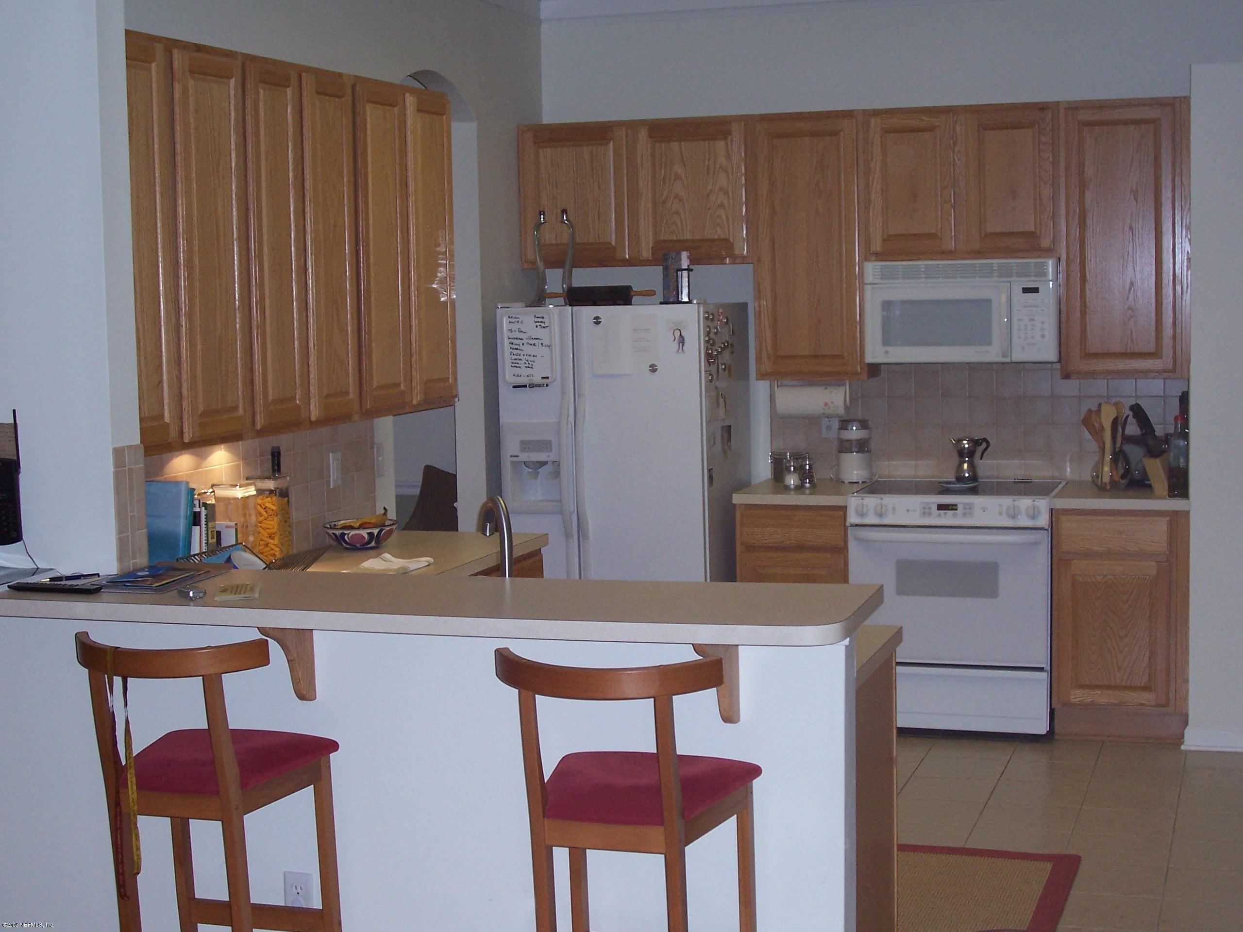 841 Mill Stream Road Ponte Vedra Beach, FL 32082 - Photo 5 of 7 a kitchen with a sink cabinets and window