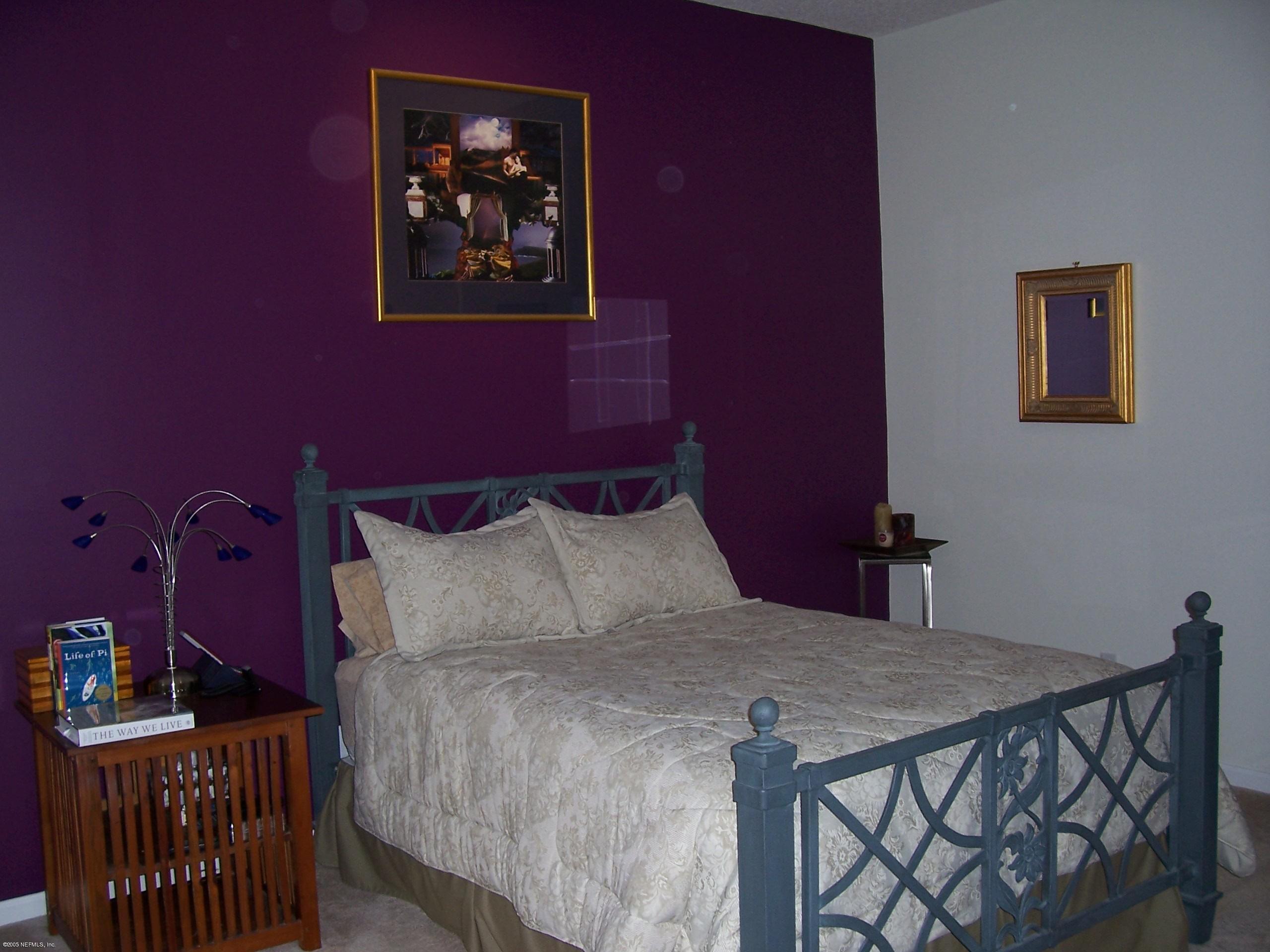 841 Mill Stream Road Ponte Vedra Beach, FL 32082 - Photo 6 of 7 a bedroom with a bed and cabinets