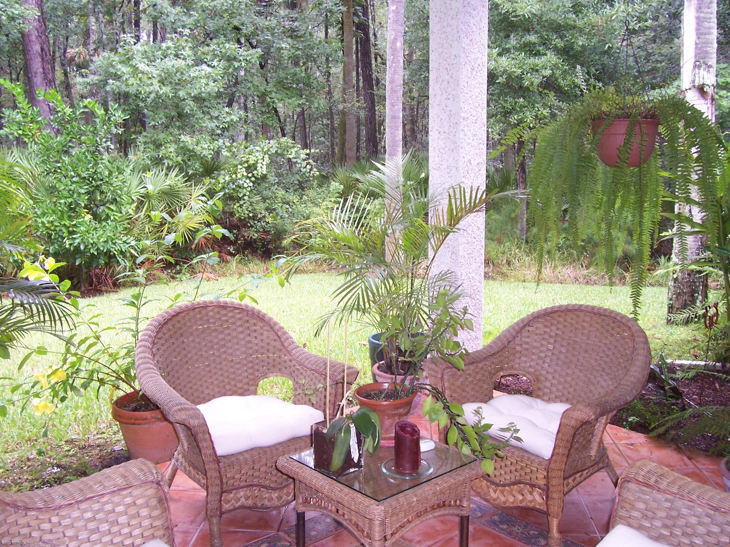 841 Mill Stream Road Ponte Vedra Beach, FL 32082 - Photo 7 of 7 a backyard of a house with outdoor seating