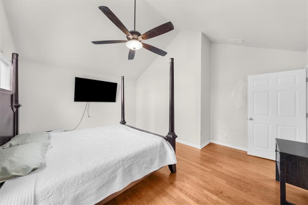2735 Gateview Court Cumming, GA 30040 - Photo 20 of 35 a bedroom with a bed and a flat screen tv
