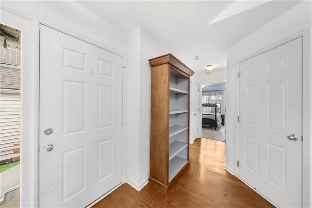 2735 Gateview Court Cumming, GA 30040 - Photo 24 of 35 a view of a hallway with wooden floor and closet