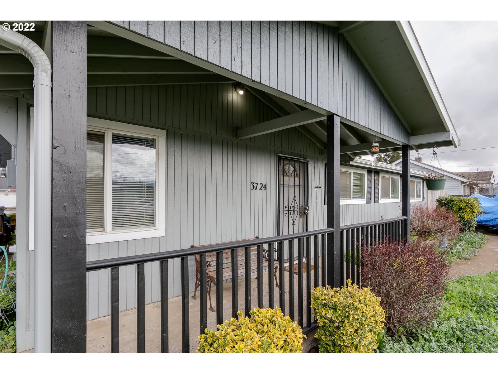 3724 E Street Springfield, OR 97478 - Photo 2 of 16 a couple of flower plants in front of door