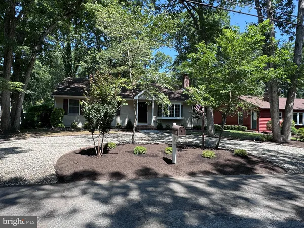 a view of a house with backyard porch and sitting area