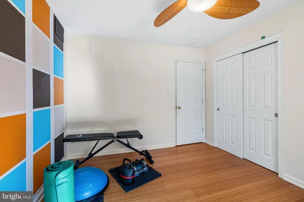 a bedroom with a bed and a closet