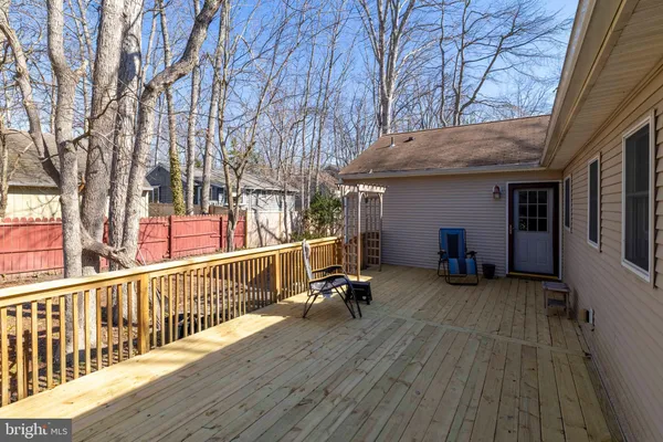 a view of a house with pool and wooden floor