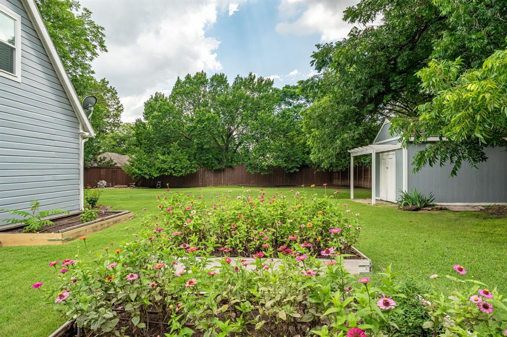 9121 6th Street Frisco, TX 75033 - Photo 22 of 27 a view of a house with a yard and garden