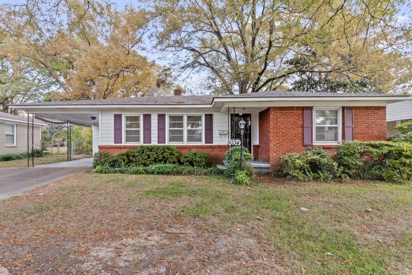 front view of a house with a yard