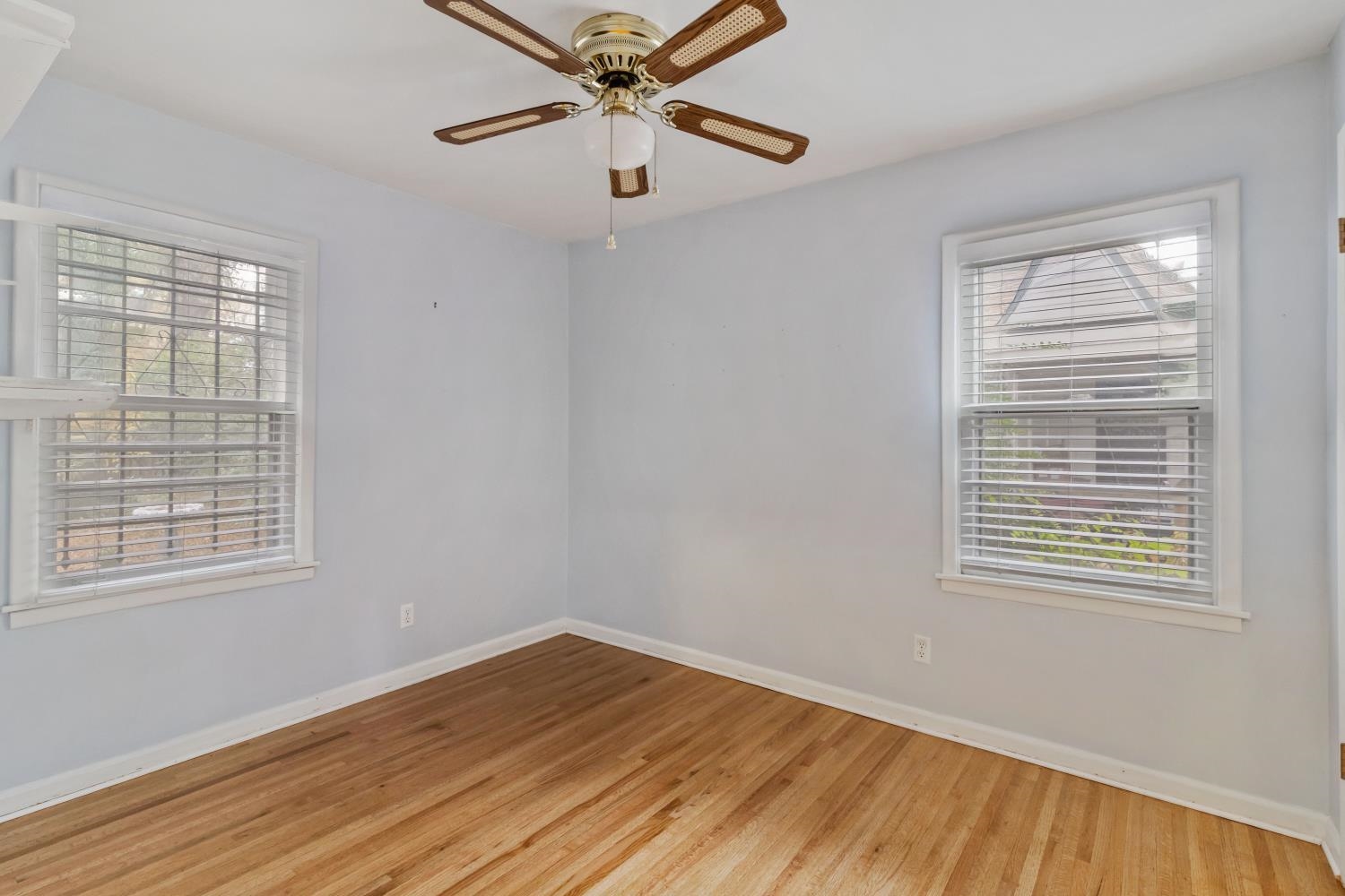 5034 Quince Road Memphis, TN 38117 - Photo 20 of 25 a view of an empty room with wooden floor and a window