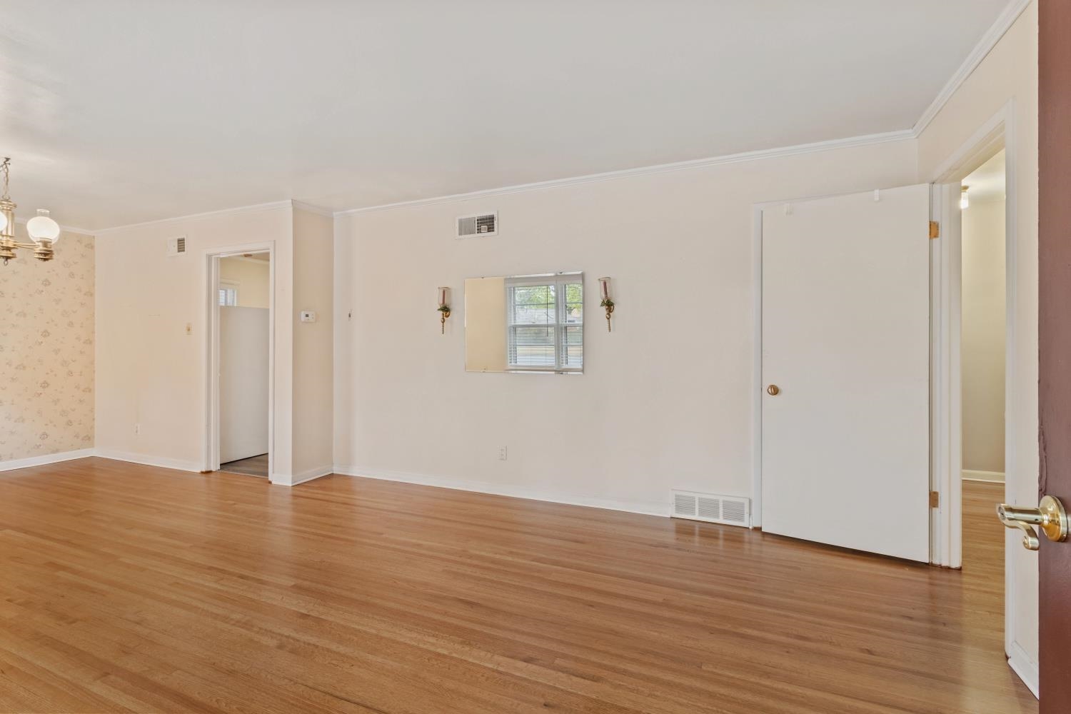 5034 Quince Road Memphis, TN 38117 - Photo 3 of 25 a view of an empty room with wooden floor