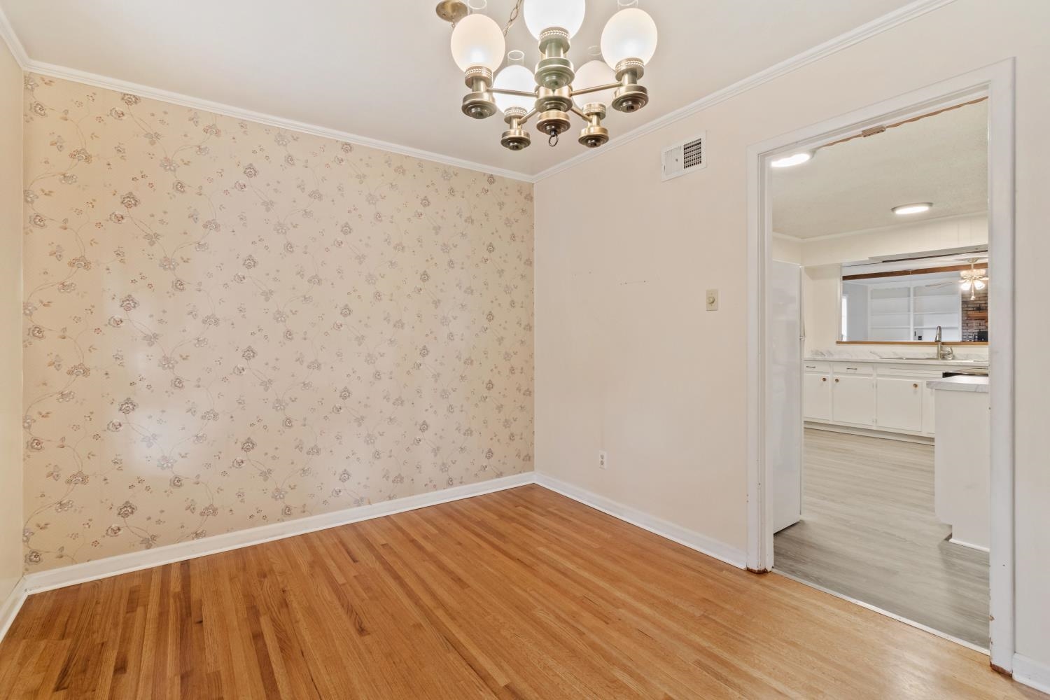 5034 Quince Road Memphis, TN 38117 - Photo 7 of 25 a view of a room with wooden floor and mirror
