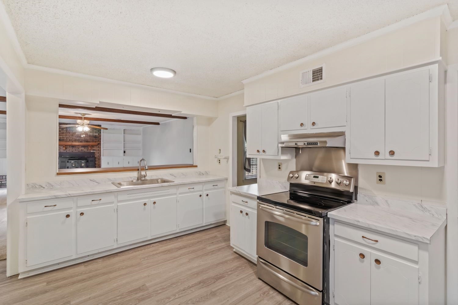 5034 Quince Road Memphis, TN 38117 - Photo 8 of 25 a kitchen with appliances cabinets and a sink