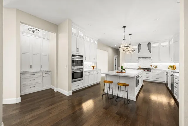 a kitchen with cabinets and stainless steel appliances