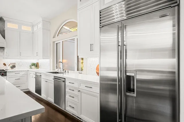 a living room with furniture and entry gate