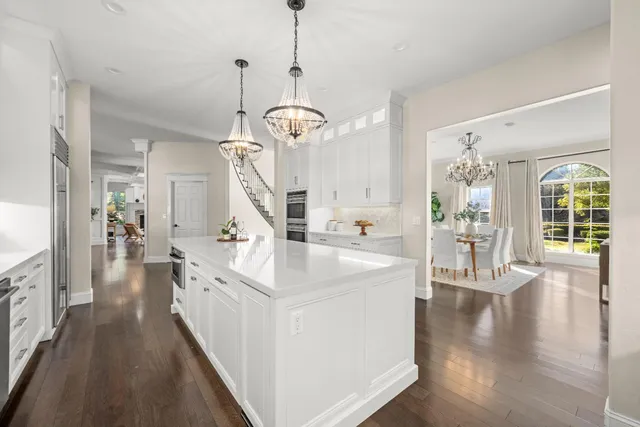wooden floor in an empty room with a fireplace