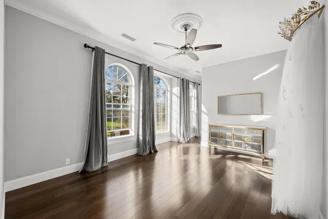 a white bath tub sitting in a bathroom next to a window